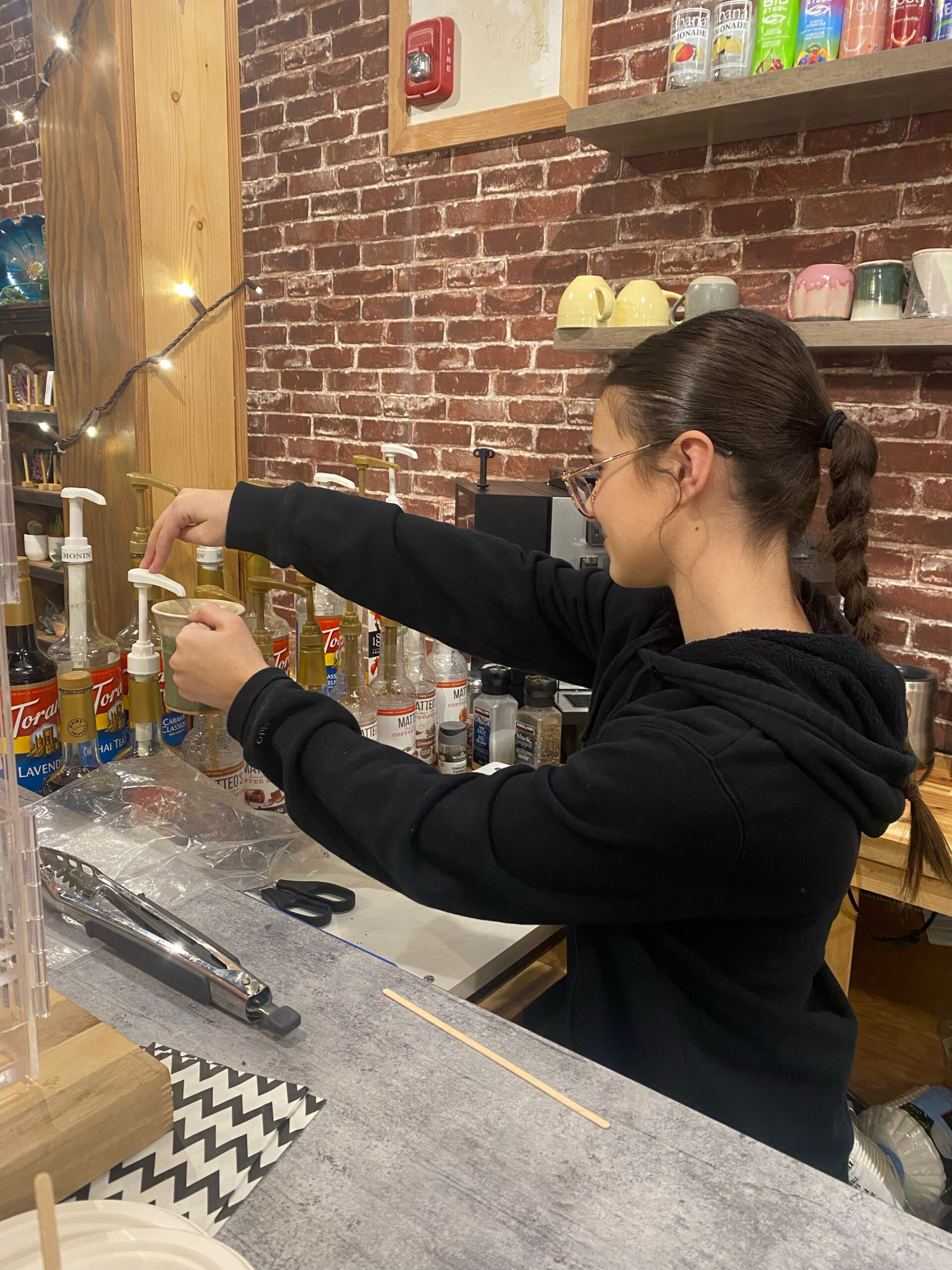 A girl helping in a local flower shop.
