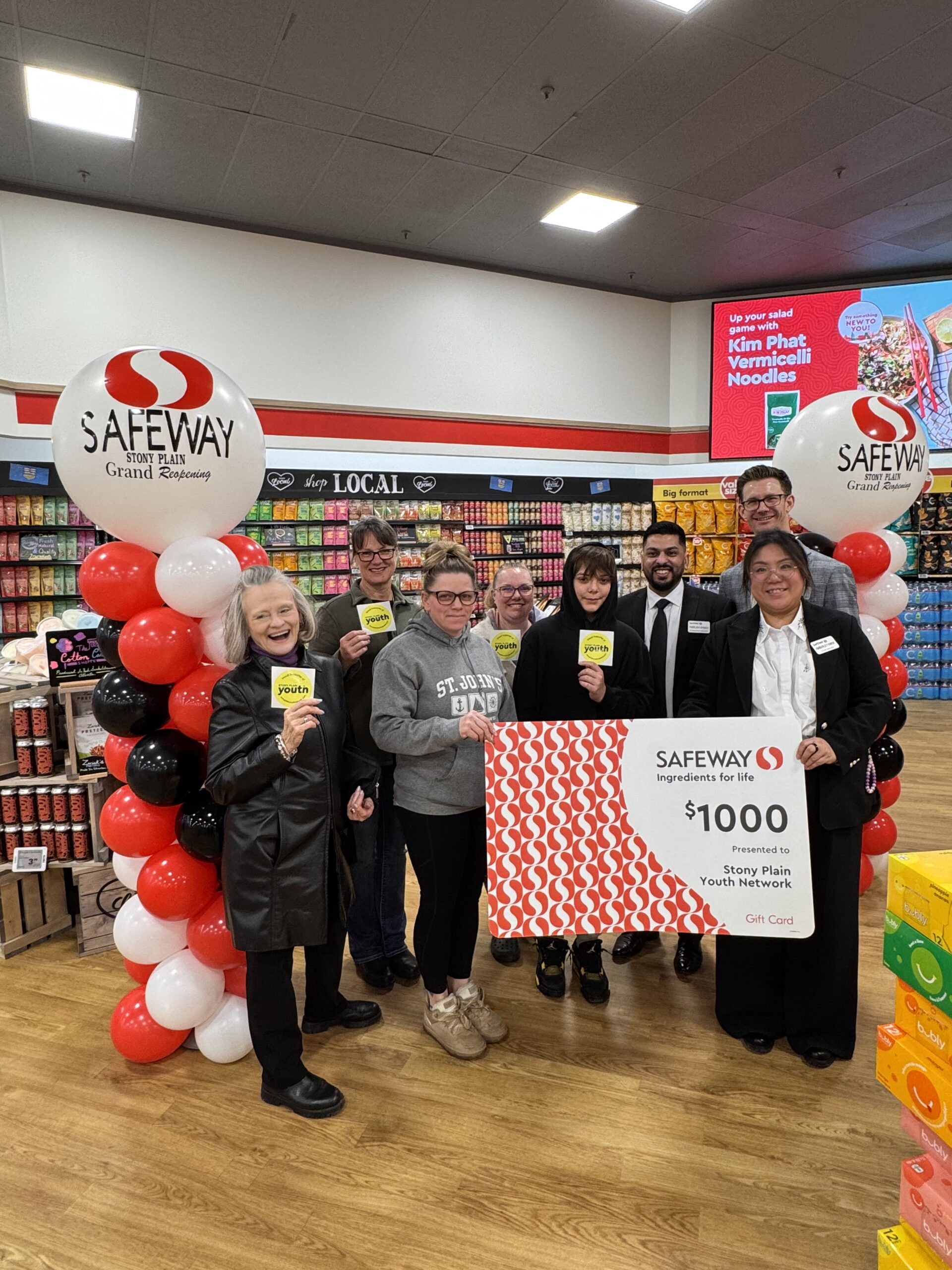 Accepting a cheque from a local grocery store.